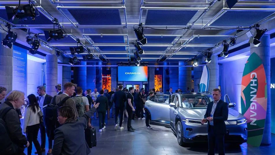 Guests exploring Changan vehicles inside the European brand launch venue.