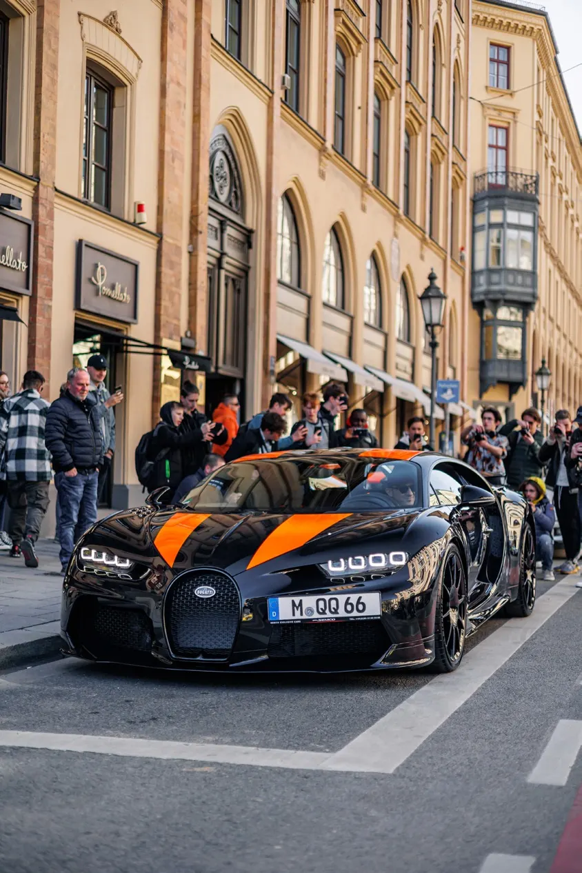 Sports car framed through an architectural foreground.