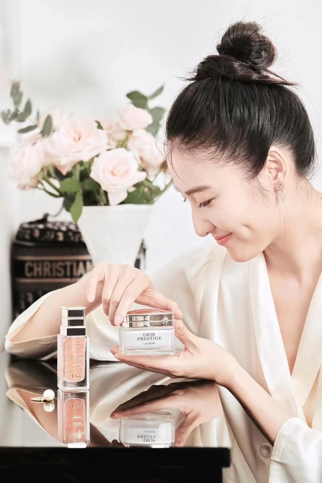 Lifestyle beauty portrait featuring cosmetic products.